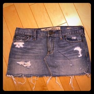 Distressed and deconstructed denim skirt